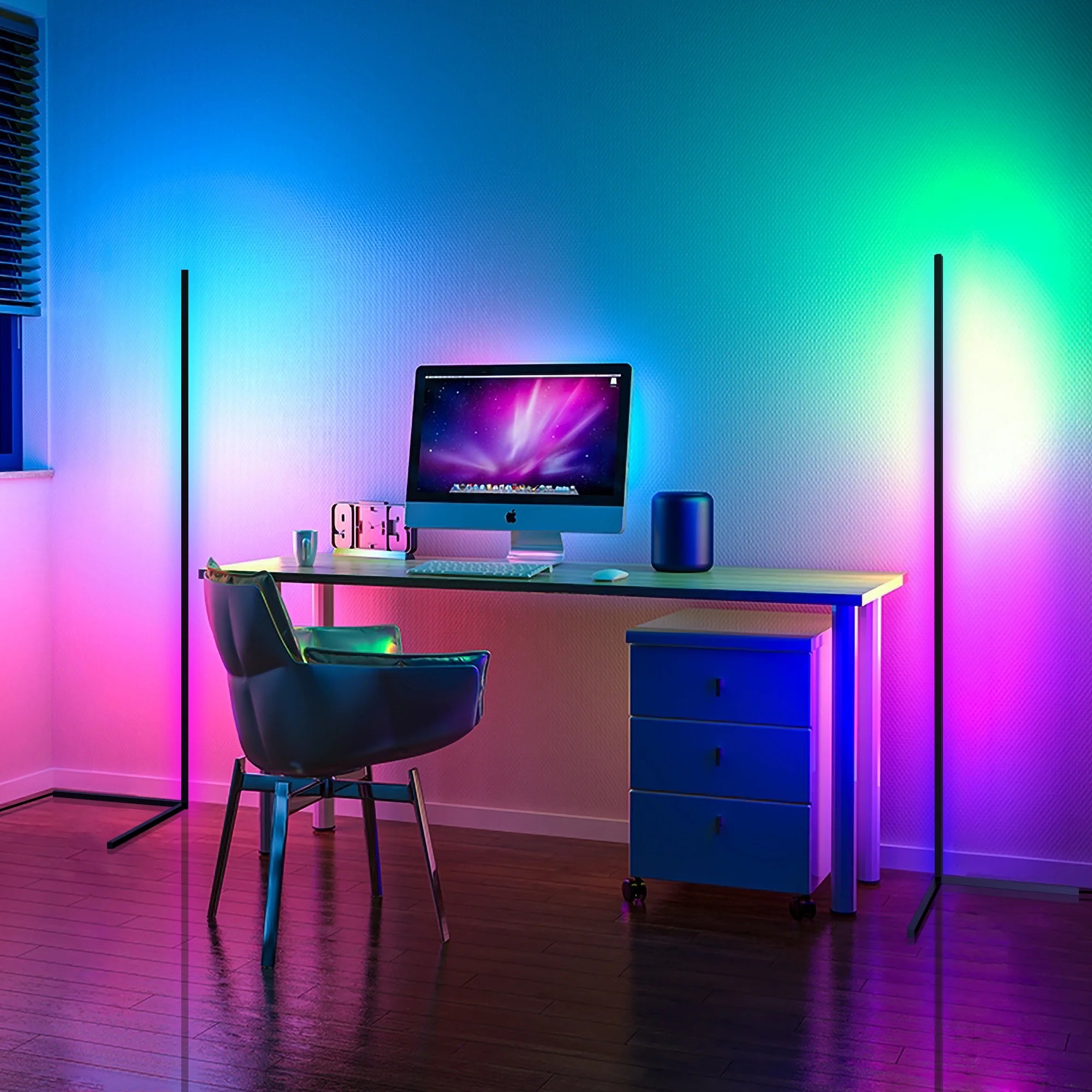 A cool gaming desk or work desk with an Enlights LED vertical strip lamp on a V stand on either side with pink, green, and white lights. 